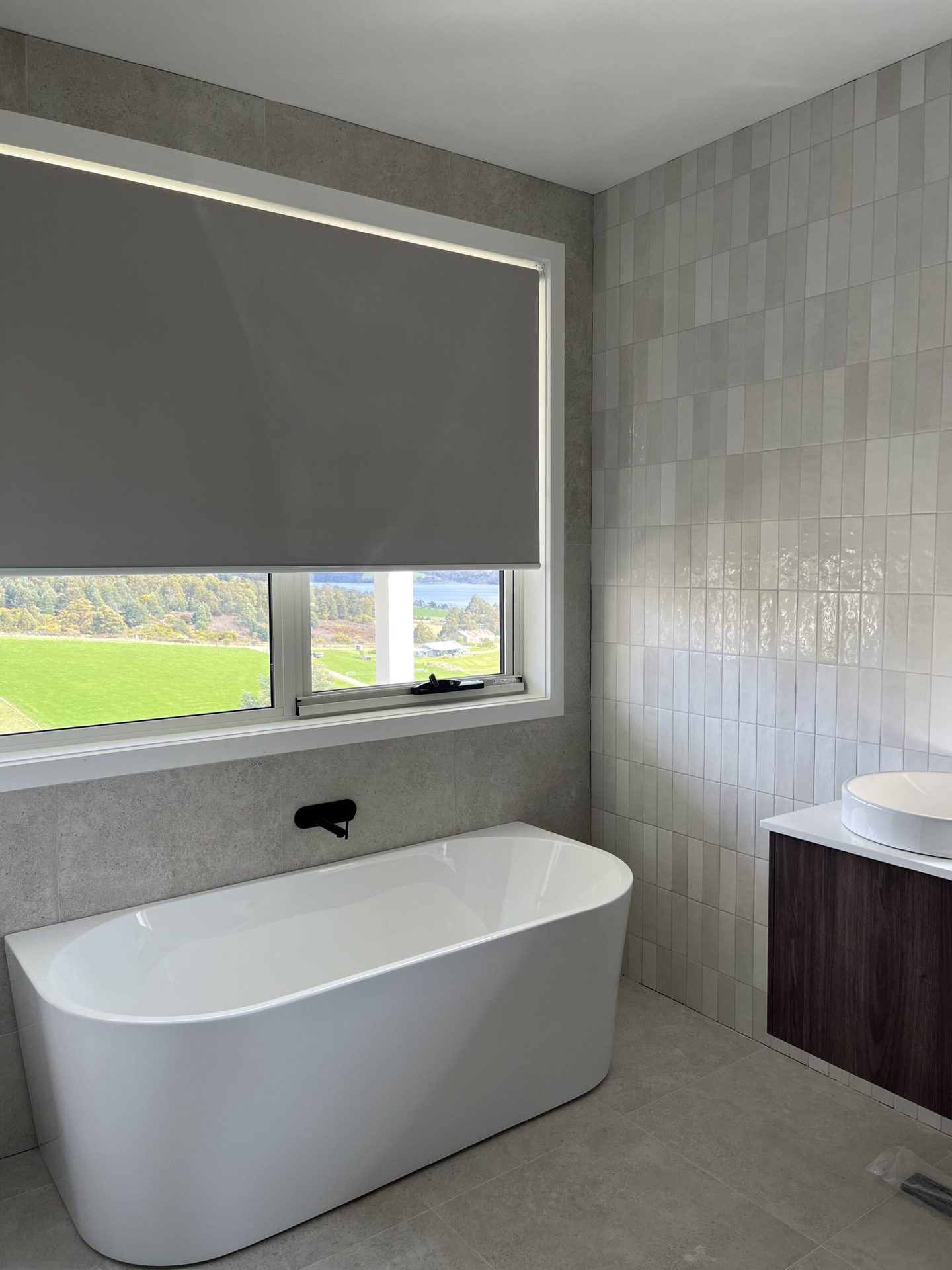Blockout roller blind lowered over a bedroom window