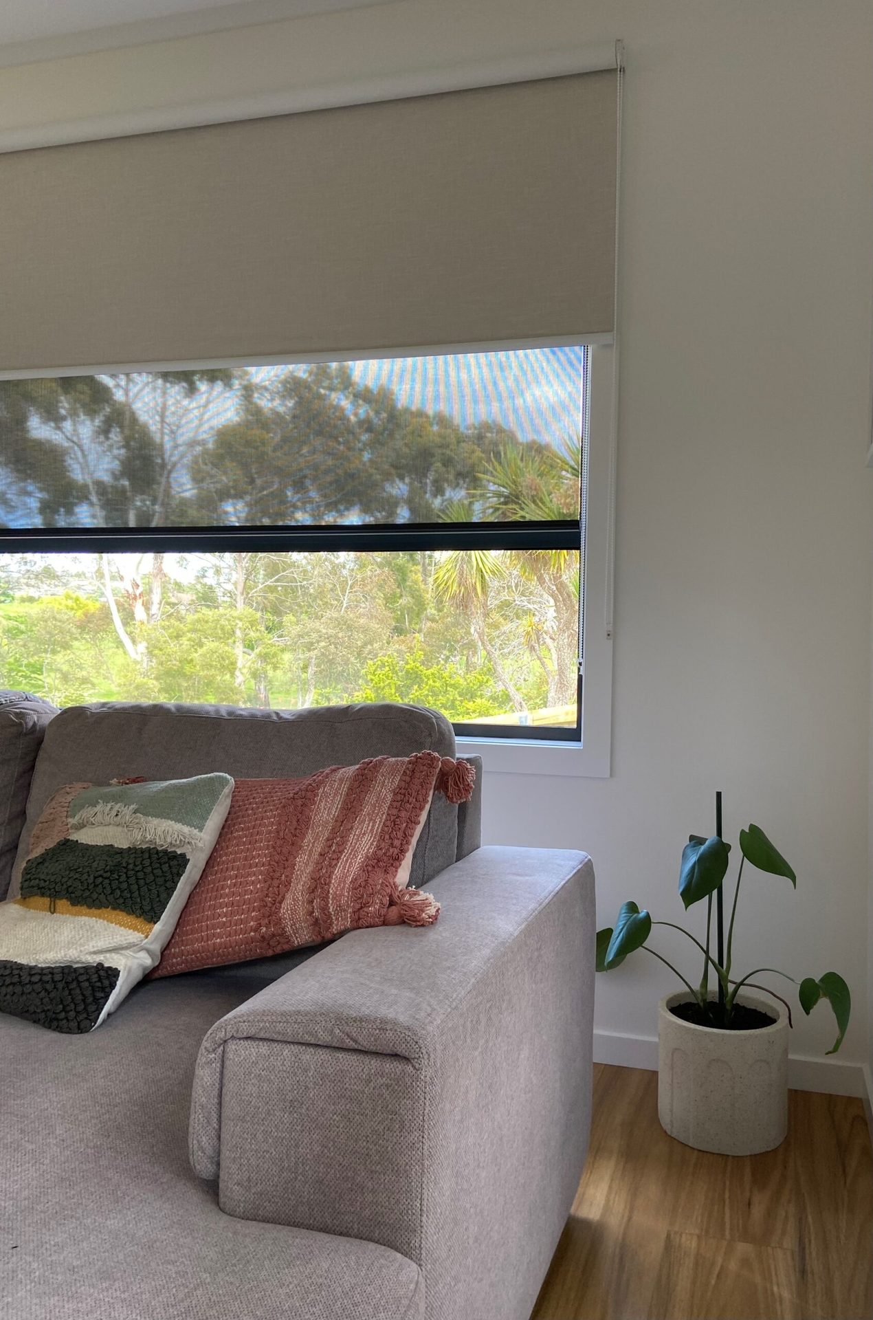 Dual roller blinds fitted to a tall window