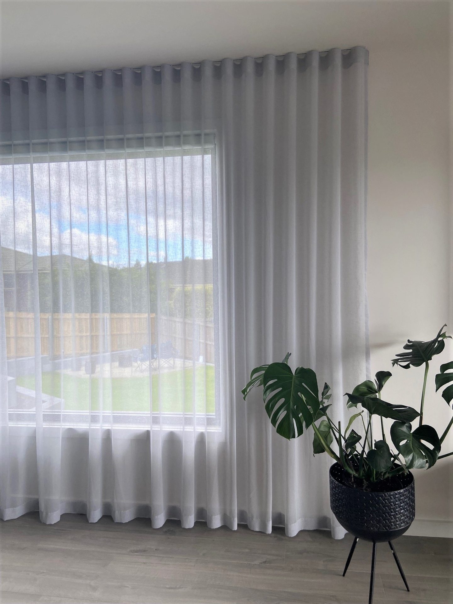 Sheer curtain beside a dining table