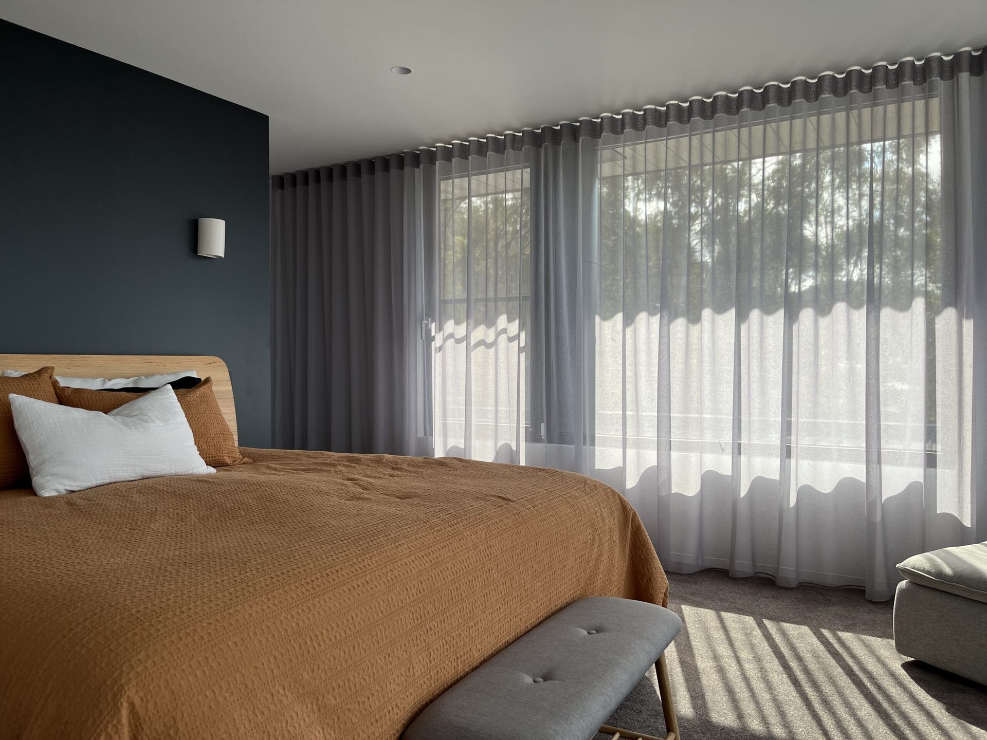 Sheer curtains filtering daylight into a living space